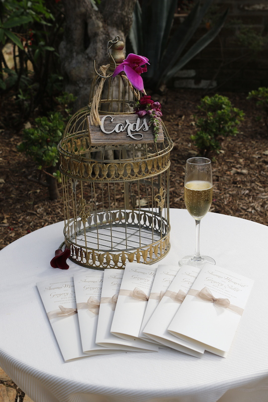 birdcage, champagne flute, wedding programs