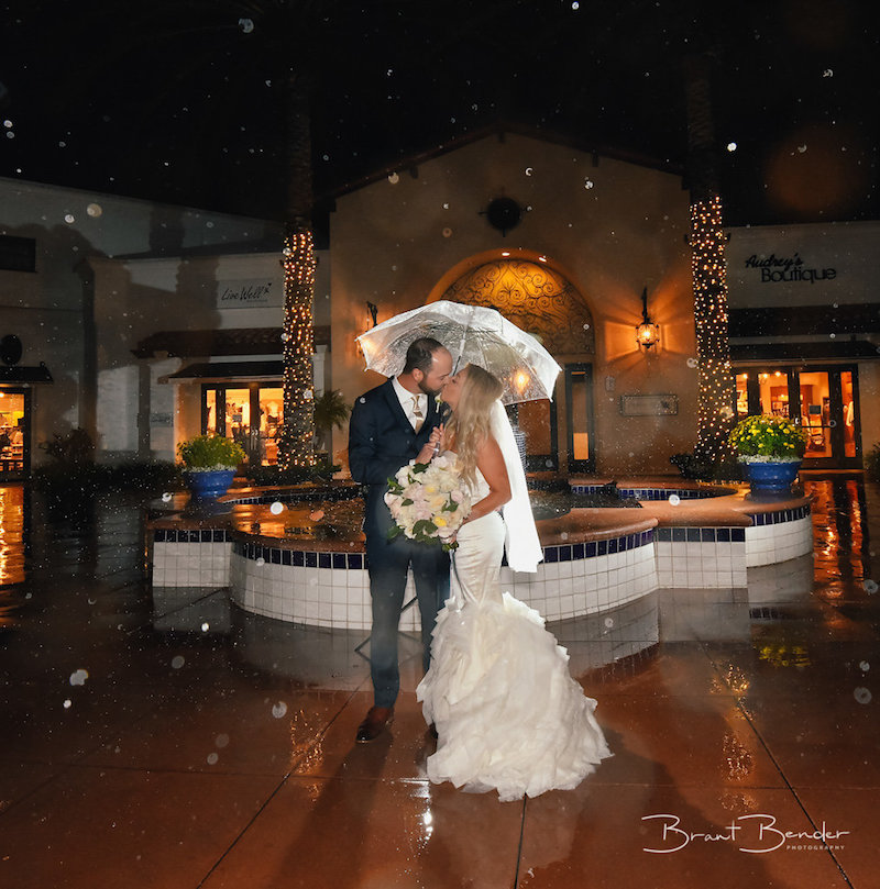 Bride, groom, bouquet, umbrella, rain