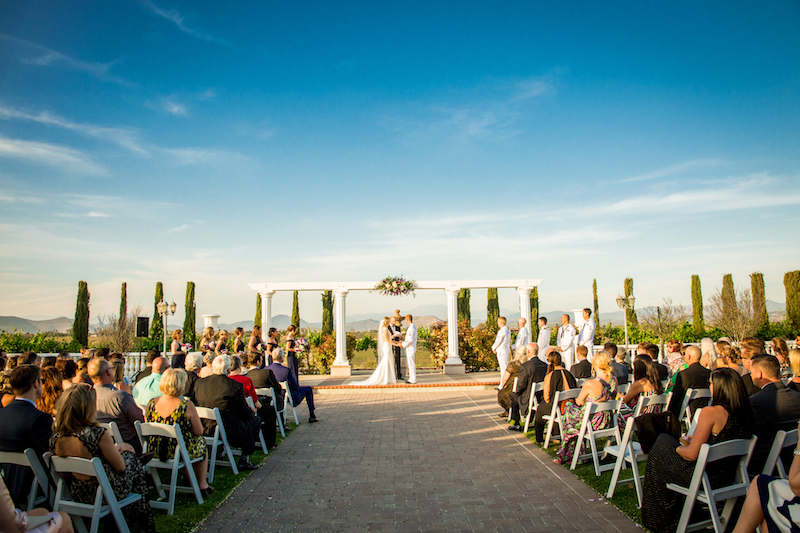 bride, groom, exchanging vows, winery
