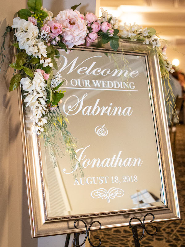 wedding sign, mirror, flowers