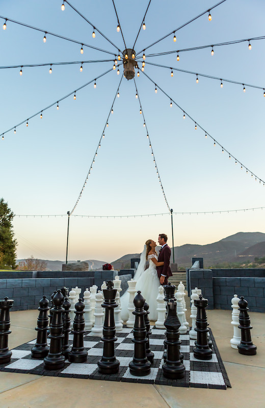bride, groom, giant chess game