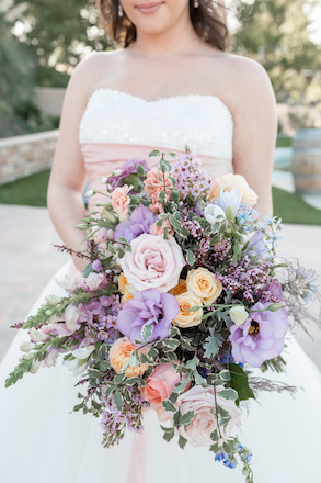 bride in wedding dress holding bouquet