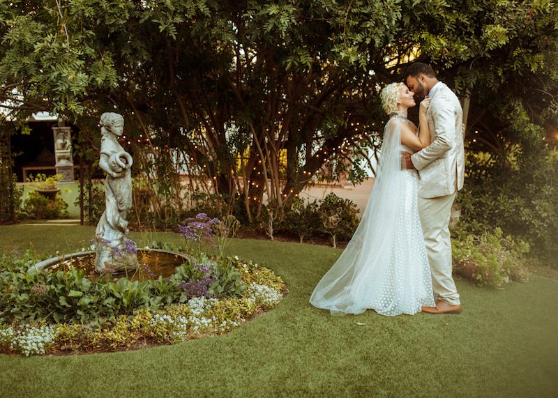 bride and groom in a garden