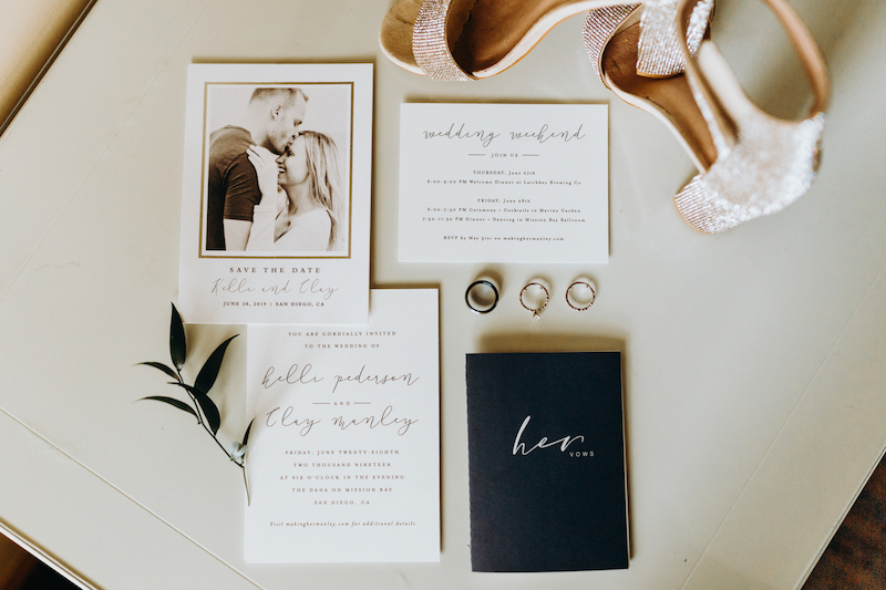 wedding invitations, vow books, wedding rings